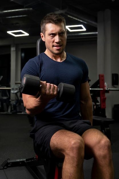 Young adult doing indoor sport at the gym