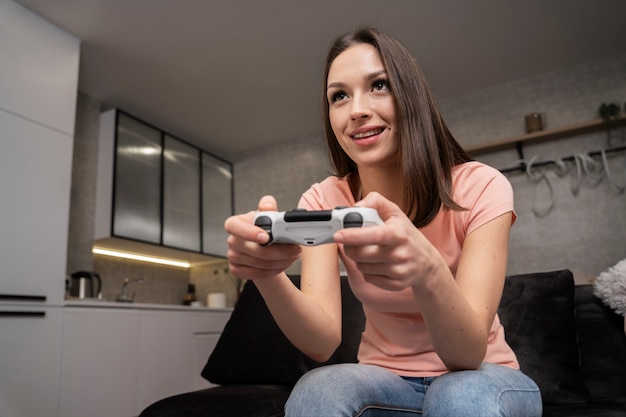 Young adult enjoying playing video game