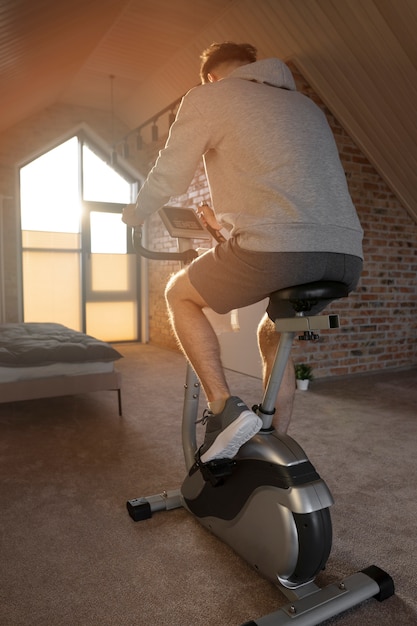 Free photo young adult exercising at home