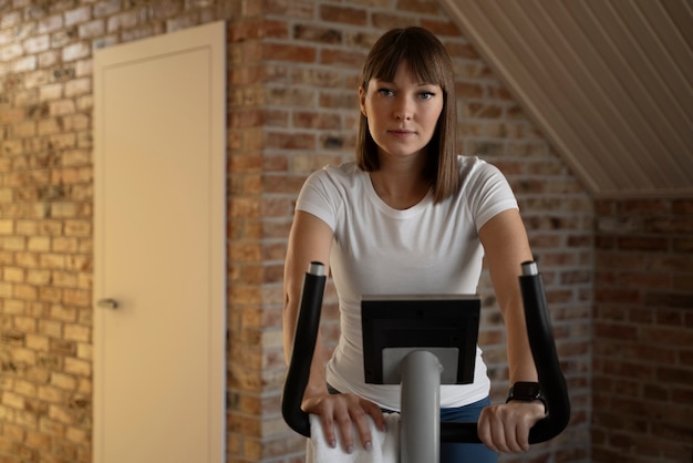 Free photo young adult exercising at home