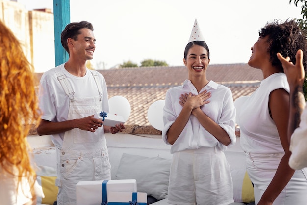 Free photo young adult having fun at white party