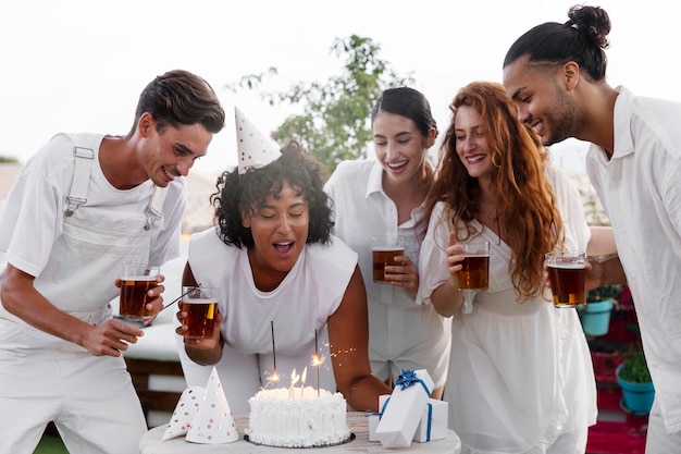 Young adult having fun at white party