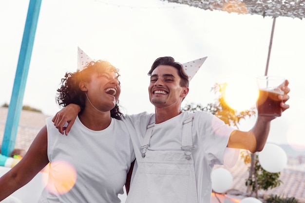 Young adult having fun at white party