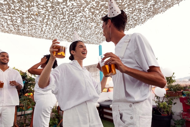 Young adult having fun at white party