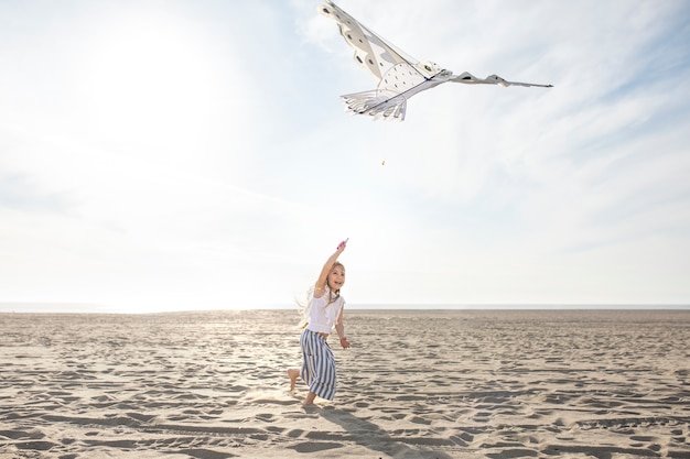 Free photo young adult having fun with kite