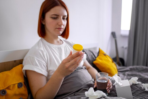 Young adult at home suffering from illness