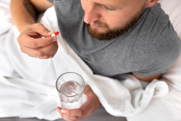 Young adult at home suffering from illness