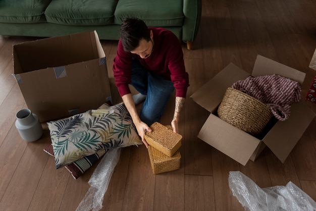 Free Photo young adult moving into a new home