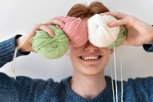 Free Photo young adult ready for knitting at home