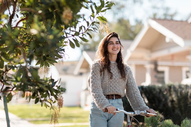 Free Photo young adult traveling using sustainable mobility