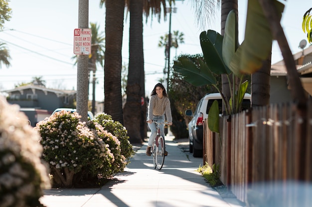 Young adult traveling using sustainable mobility