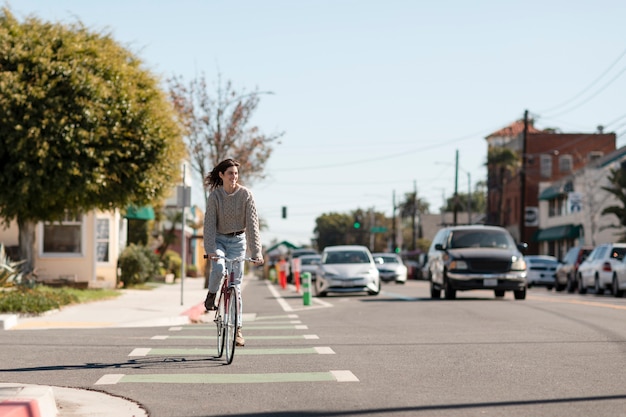 Free Photo young adult traveling using sustainable mobility