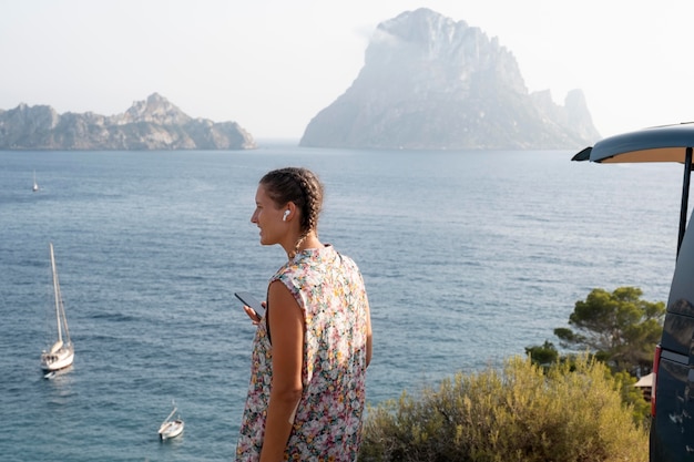 Free photo young adult travelling in her van