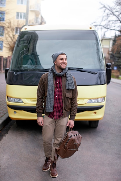 Free photo young adult travelling in winter time