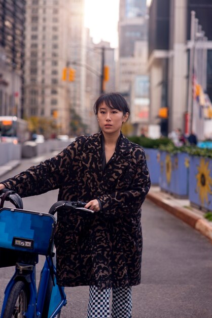 Young adult using bike to travel in the city