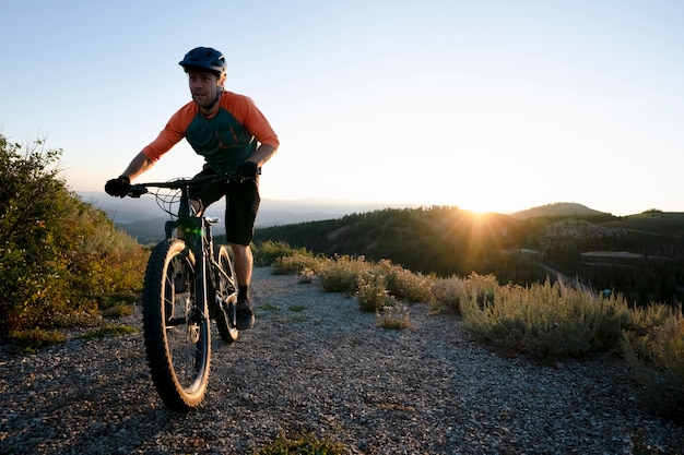 Young adult using electric bike in the country side