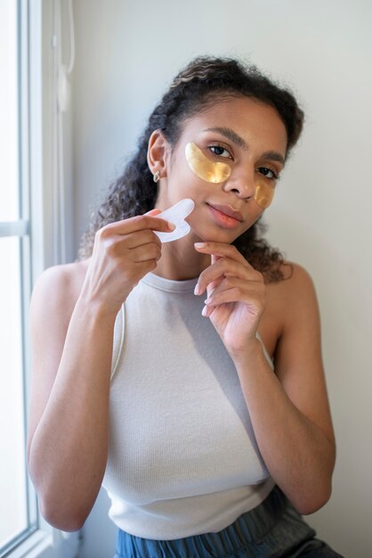 Young adult using face care product