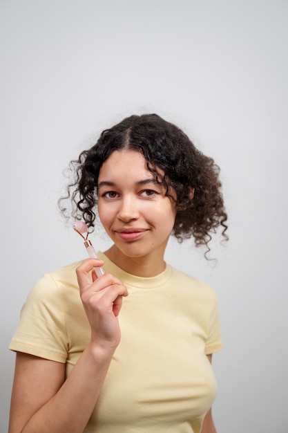 Young adult using face care product