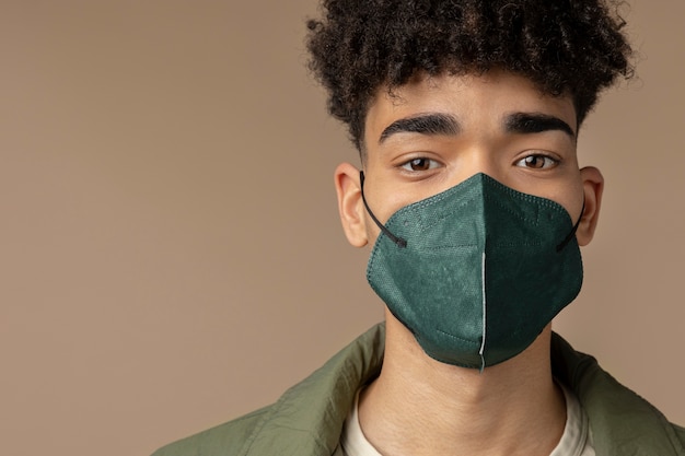 Free photo young adult wearing face mask