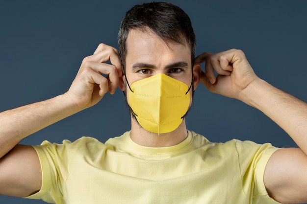 Free Photo young adult wearing face mask