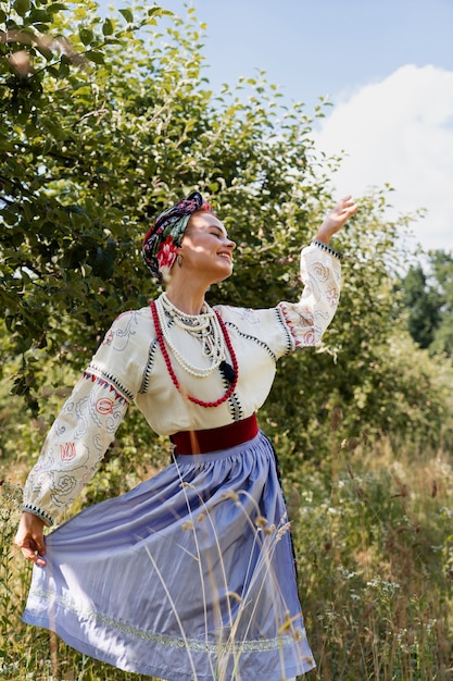 Free photo young adult wearing folk dance costume