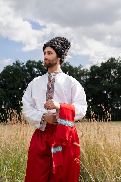 Free photo young adult wearing folk dance costume