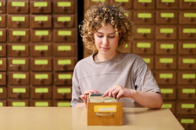 Young adult working in library office