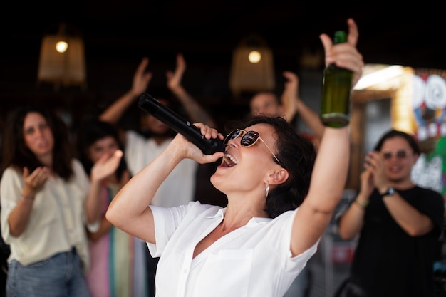 Free photo young adults having fun at open mic