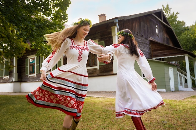 Free Photo young adults having fun while folk dancing