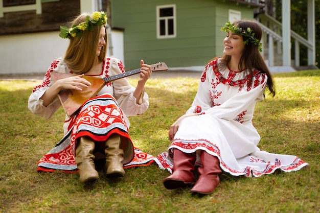 Free photo young adults having fun while folk dancing