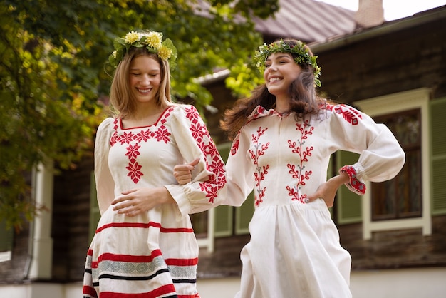 Free photo young adults having fun while folk dancing