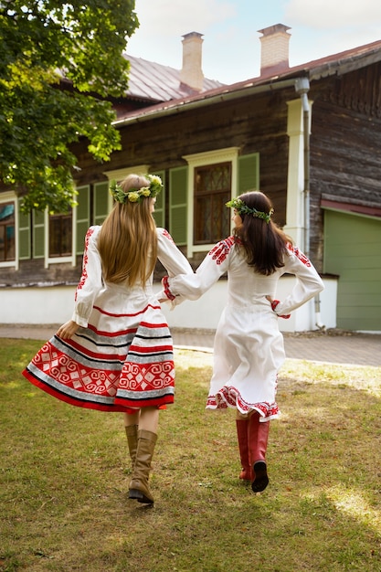 Free photo young adults having fun while folk dancing