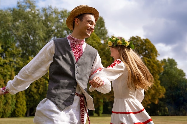 Young adults having fun while folk dancing