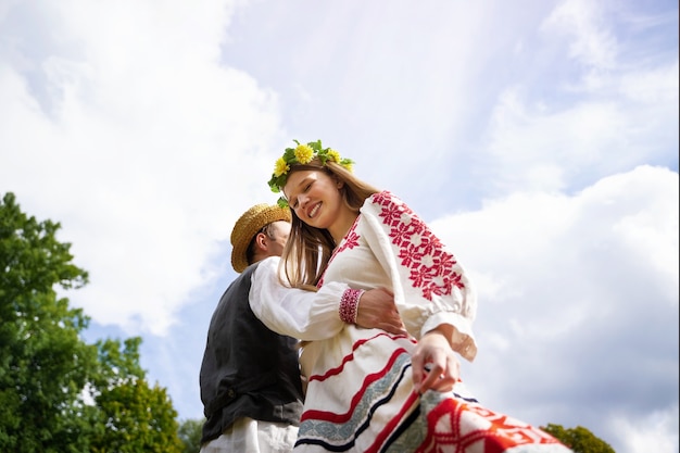 Young adults having fun while folk dancing