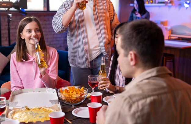 Young adults having a party at home