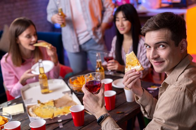 Young adults having a party at home