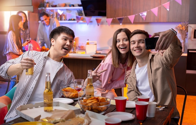 Young adults having a party at home