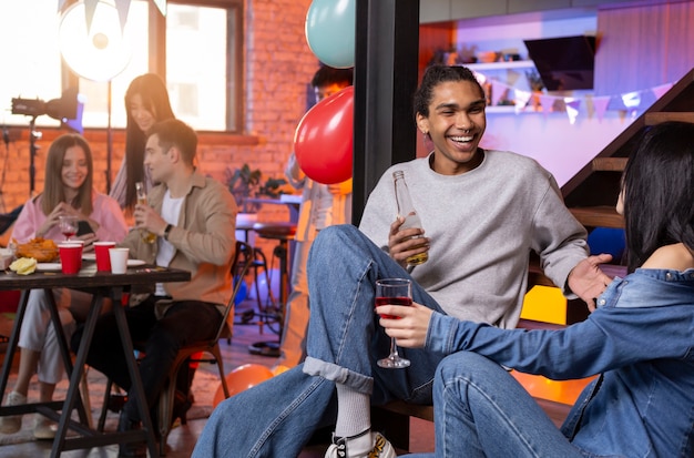 Young adults having a party at home