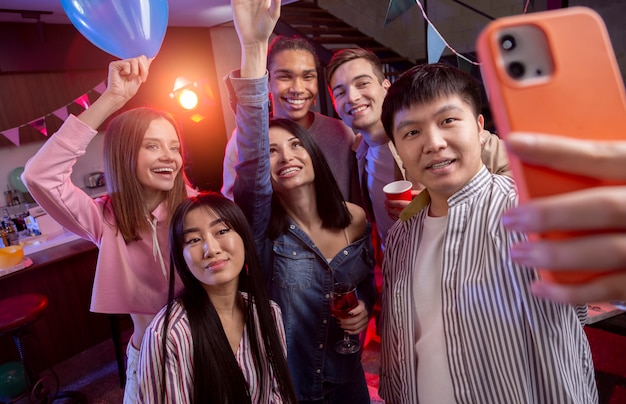 Free photo young adults having a party at home