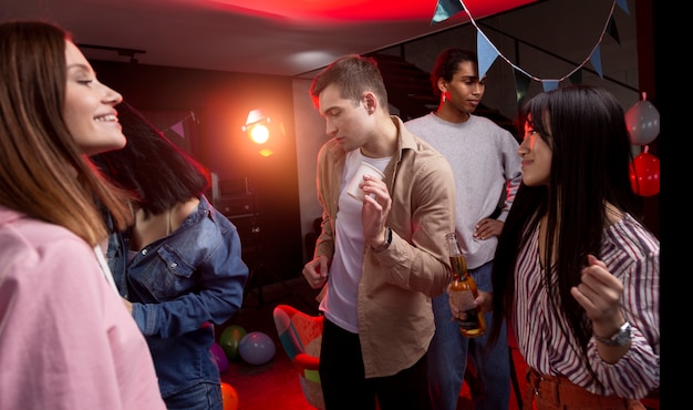 Young adults having a party at home