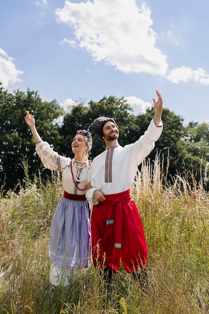 Free photo young adults wearing folk dance costume