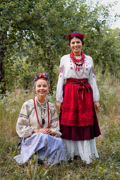 Free Photo young adults wearing folk dance costume