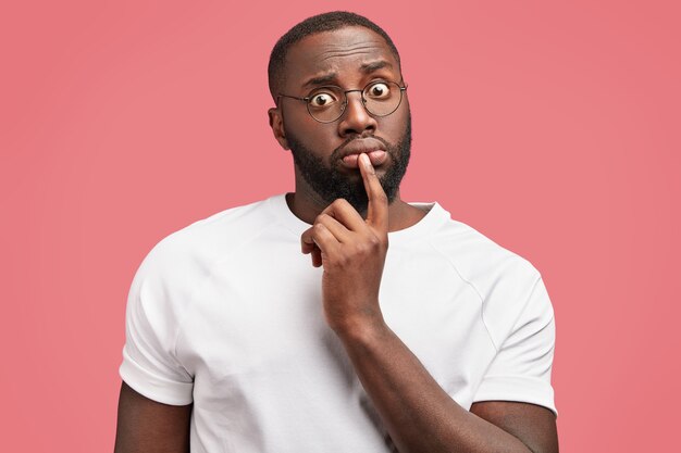 Young African-American man in white T-shirt