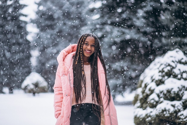 Young african american woman in winter outside in park