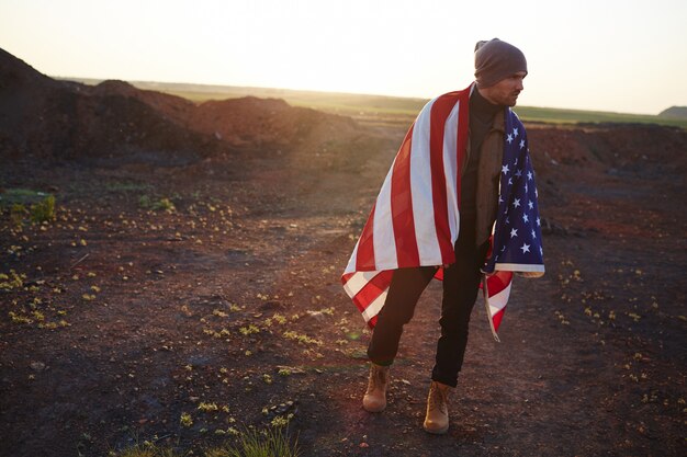 Young American Man Walking in Mountains