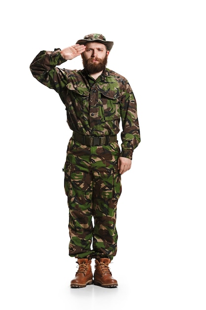 Free photo young army soldier wearing camouflage uniform isolated on white