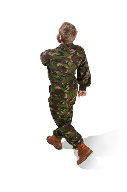 Young army soldier wearing camouflage uniform isolated on white