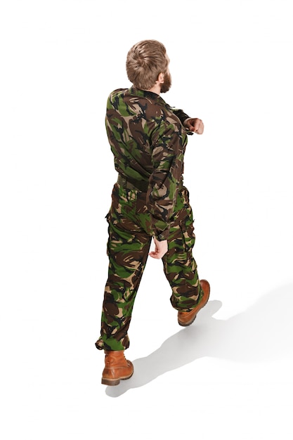 Young army soldier wearing camouflage uniform isolated on white