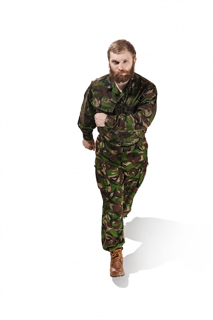 Free photo young army soldier wearing camouflage uniform