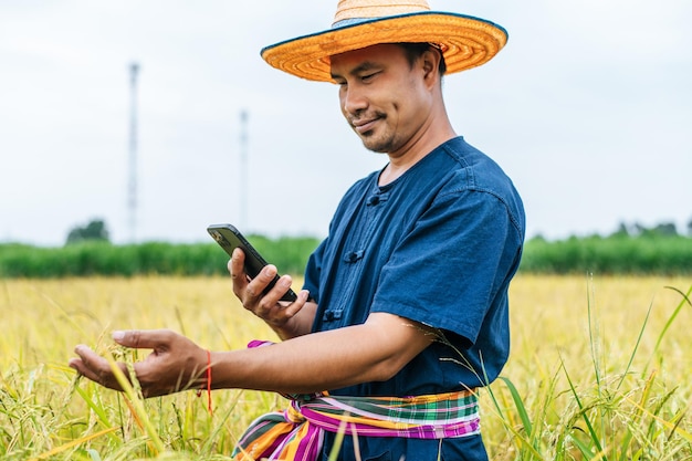 Young Asian farmer with Smartphone